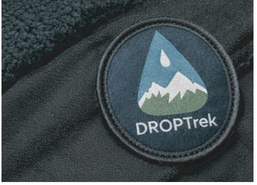 DropTrek circular patch close-up on fabric